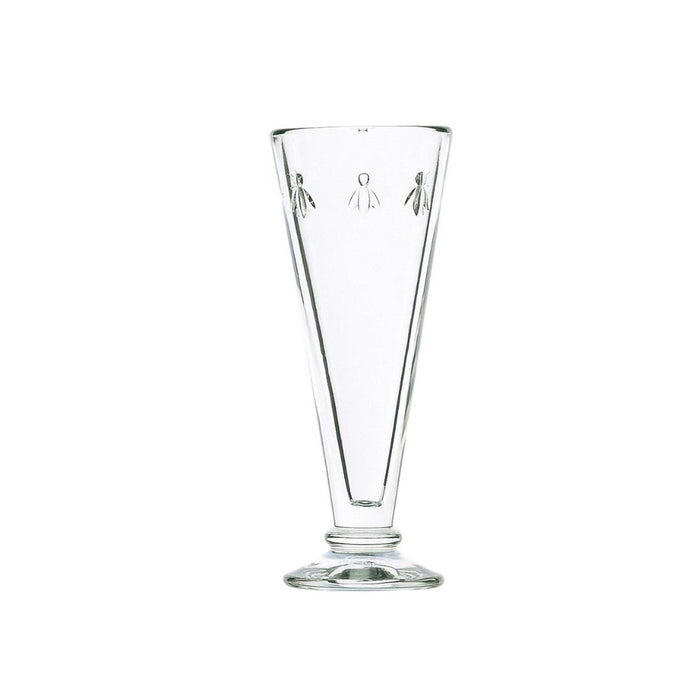 The LA ROCHERE BEE FLUTE features clear tapered glass, a short stem, and small etched bees near the rim. Upright on a round base, it adds French country charm to your sparkling wine celebrations.