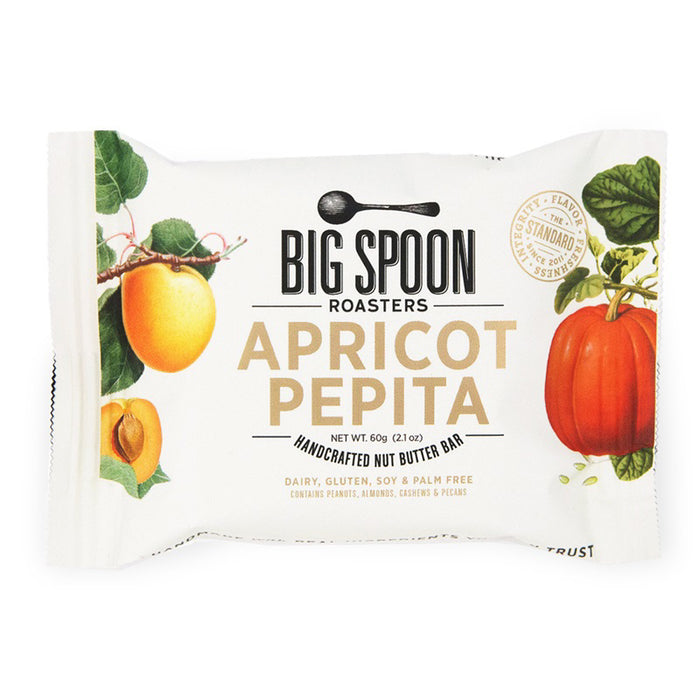 A BIG SPOON ROASTERS Apricot Pepita Peanut Snack Bar package features apricot and pumpkin illustrations and highlights that it is dairy-free, gluten-free, soy-free, and palm-free.
