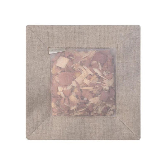 The CEDAR SQUARE SACHET NATURAL LINEN by E WIGHTMAN & CO features a square beige linen frame with a transparent center, filled with aromatic cedar shavings to naturally freshen your space.