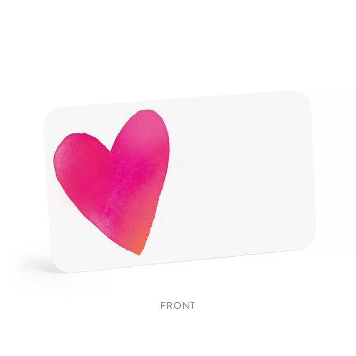 A clear box contains 85 tiny notecards each featuring a pink heart, labeled "E. FRANCES PAPER - BIG HEART LITTLE NOTES." With the tagline "use unsparingly," this minimalistic packaging enhances its unique charm.