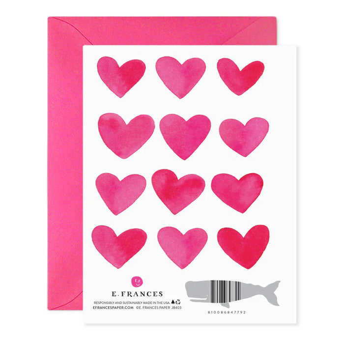 The E. FRANCES PAPER "If I Had More Hearts" Valentine Greeting Card features twelve pink watercolor hearts in a 3x4 grid on luxurious paper, with a message: "If I had more hearts, they would all be yours," and comes with a matching pink envelope.