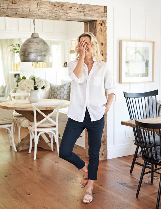The FRANK & EILEEN Murphy Billion Dollar Pant in black, featuring a tailored waistband and side pockets, is displayed flat on a white textured background.