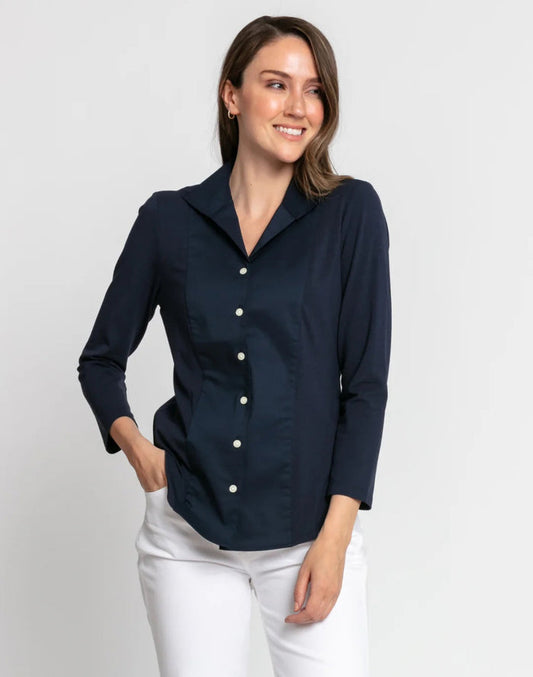 A woman with blonde hair tied back is wearing the HINSON WU DONNA 3/4 SLEEVE TOP and black pants, standing against a plain light background and looking at the camera.