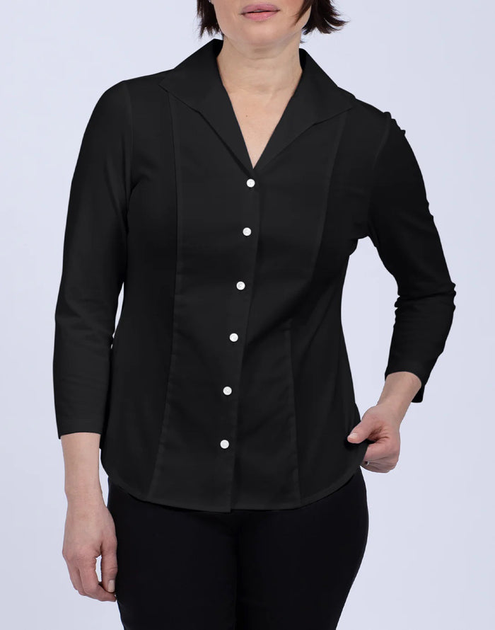 A woman with blonde hair tied back is wearing the HINSON WU DONNA 3/4 SLEEVE TOP and black pants, standing against a plain light background and looking at the camera.