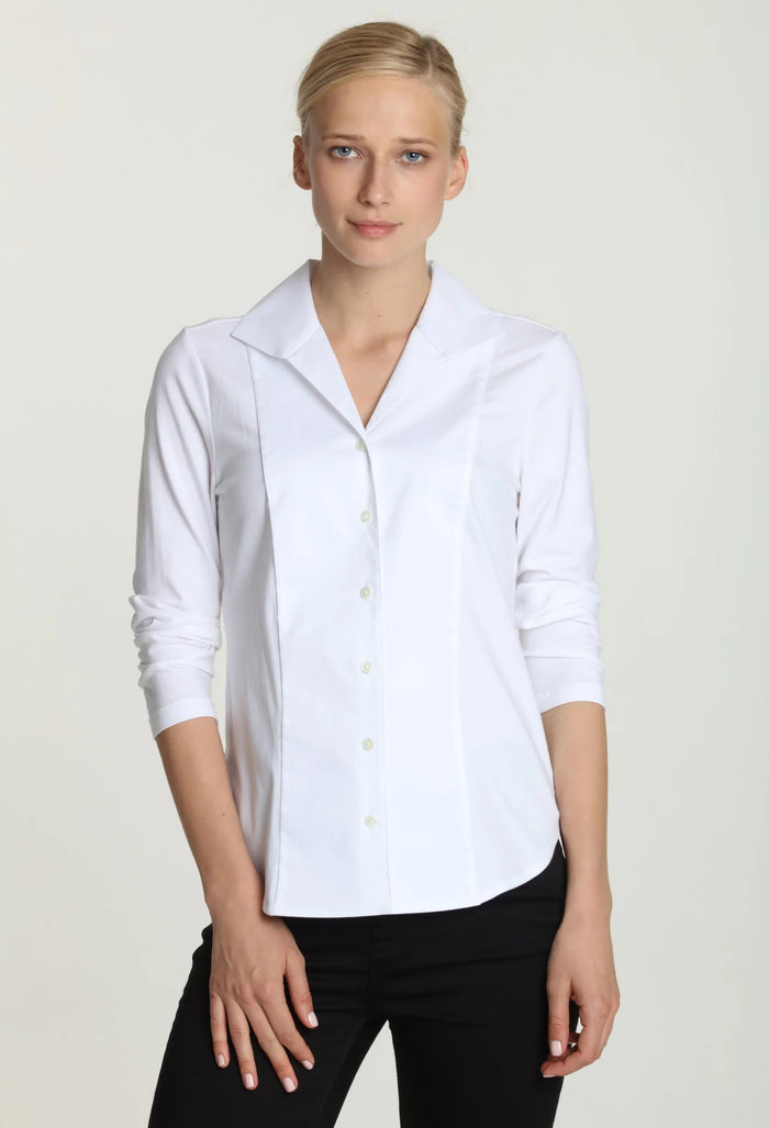 A woman with blonde hair tied back is wearing the HINSON WU DONNA 3/4 SLEEVE TOP and black pants, standing against a plain light background and looking at the camera.