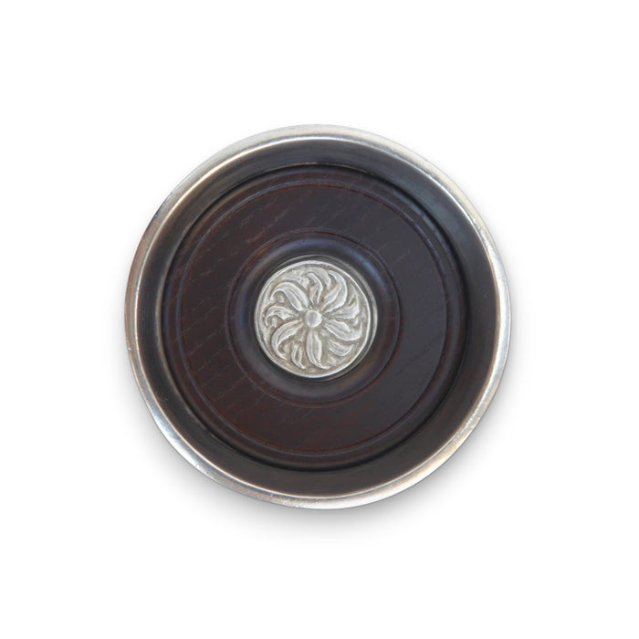 The MATCH Pewter Bottle Coaster with Wood Insert by MATCH features a smooth, round pewter design with subtle engraved lines and a wood insert, crafted from food-safe materials and shown against a white background.