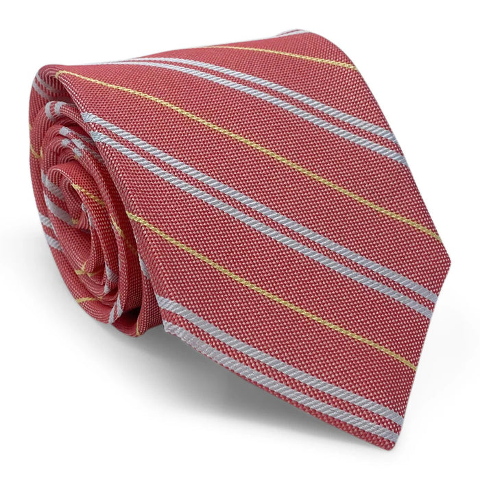 The BIRD DOG BAY PETER-BLAIR Anguilla Tie features red fabric with diagonal silver and yellow stripes, shown rolled-up on a white background.