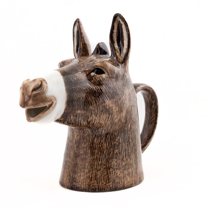The QUAIL CERAMICS - DONKEY JUG by QUAIL DESIGNS is a handpainted stoneware jug shaped like a donkey’s head with detailed brown fur, perked ears, and a back-shaped handle. Dishwasher safe for easy cleaning.