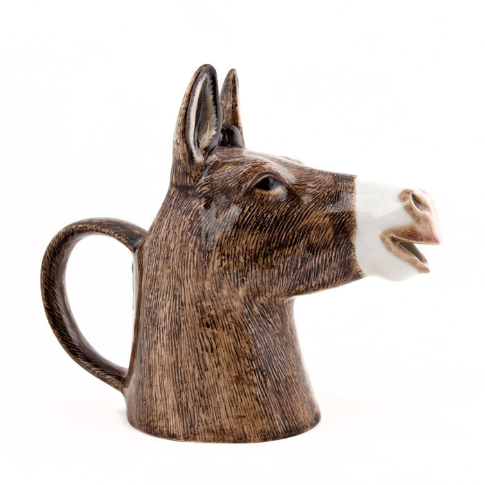 The QUAIL CERAMICS - DONKEY JUG by QUAIL DESIGNS is a handpainted stoneware jug shaped like a donkey’s head with detailed brown fur, perked ears, and a back-shaped handle. Dishwasher safe for easy cleaning.