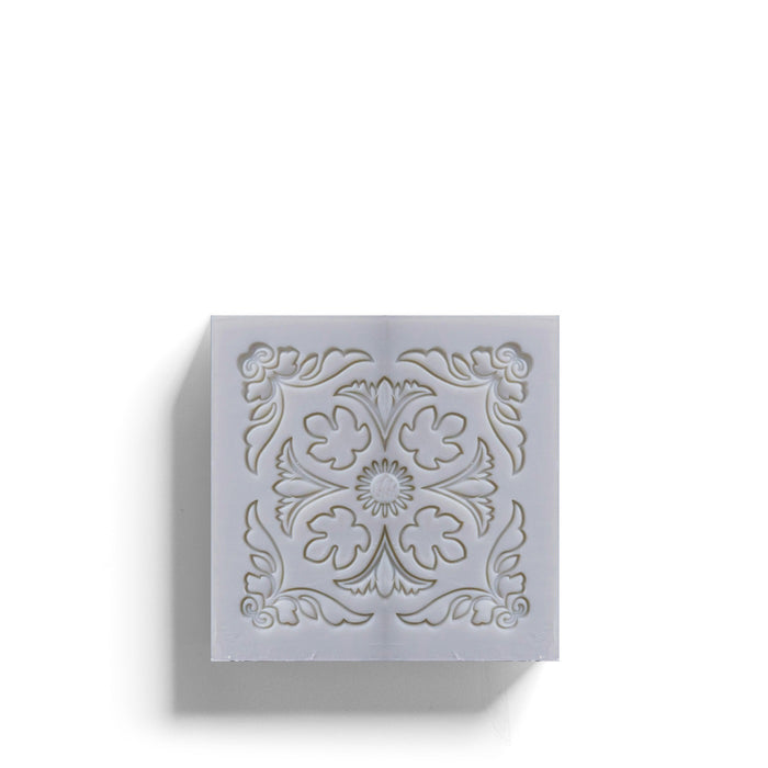 The ROSE ET MARIUS "A Stroll Under the Oratory" scented soap gift box features a decorative bar of artisanal soap, partially slid from its pink and white floral-patterned packaging, inspired by Provence.