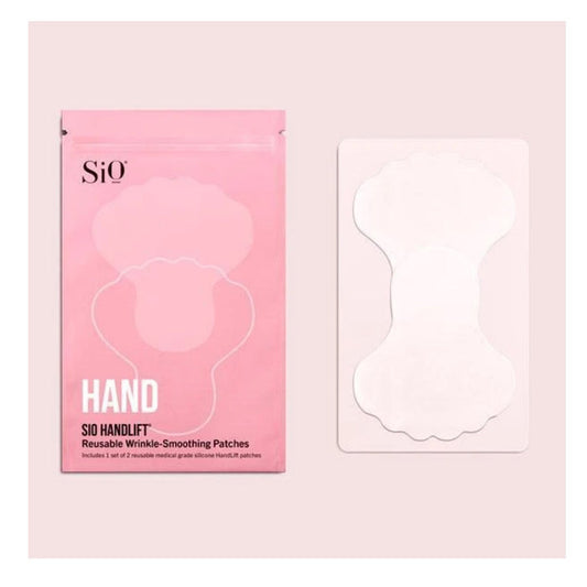 Pink "SIO HANDLIFT" packaging from SIO BEAUTY features a clear window showing anti-aging hand patches. Beside the pack, a white tray holds two translucent medical-grade silicone patches.