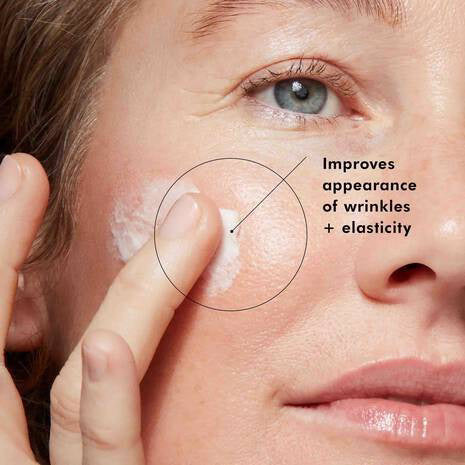 A jar of SKINCEUTICALS - A.G.E INTERRUPTER anti-wrinkle cream by SKIN CEUTICALS has a black lid, white container, and a blue "CORRECT" label, highlighting its advanced glycation end-product fighting properties.