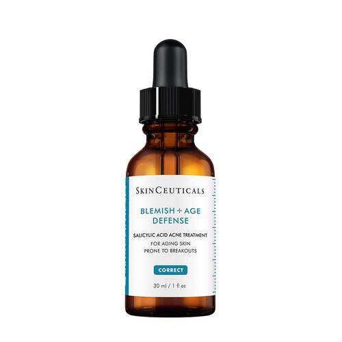 A 30ml brown glass dropper bottle labeled “SKINCEUTICALS - BLEMISH AGE DEFENSE” by SKIN CEUTICALS, a salicylic acid serum formulated to treat acne and aging skin prone to breakouts.