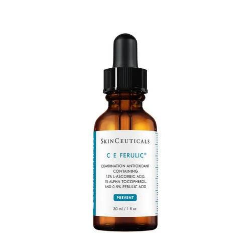 A 30 ml (1 fl oz) brown glass dropper bottle labeled "SKINCEUTICALS - CE FERULIC" by SKIN CEUTICALS, with blue and white text and a black dropper cap, contains a vitamin C serum providing antioxidant protection.